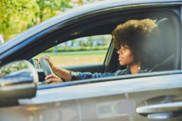 Aminata Belli drives a Mercedes